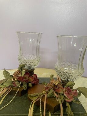 Pair of Vintage Clear Glass Hurricane Candle Holders with Floral Accents on wood